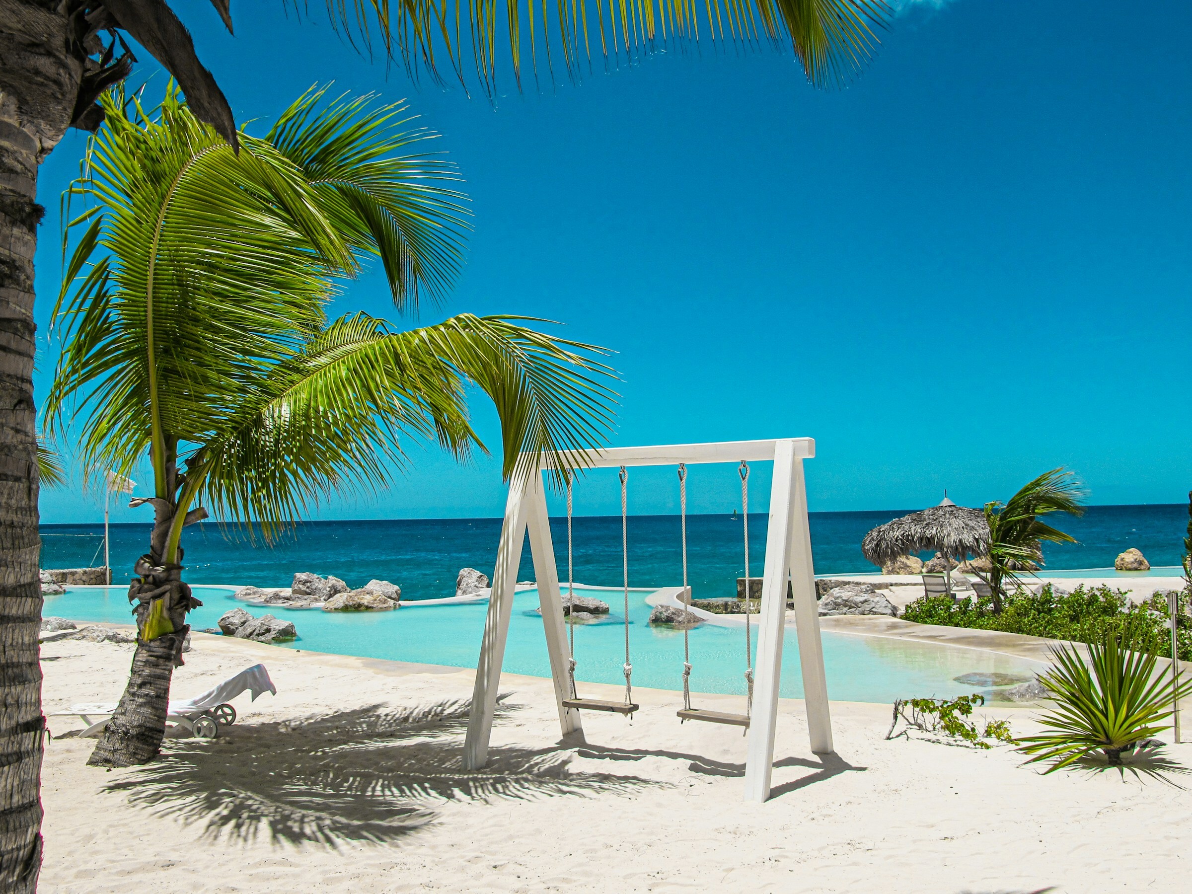 Image by Unsplash by Jonas Morgner - - view of pool, blue skies and sea